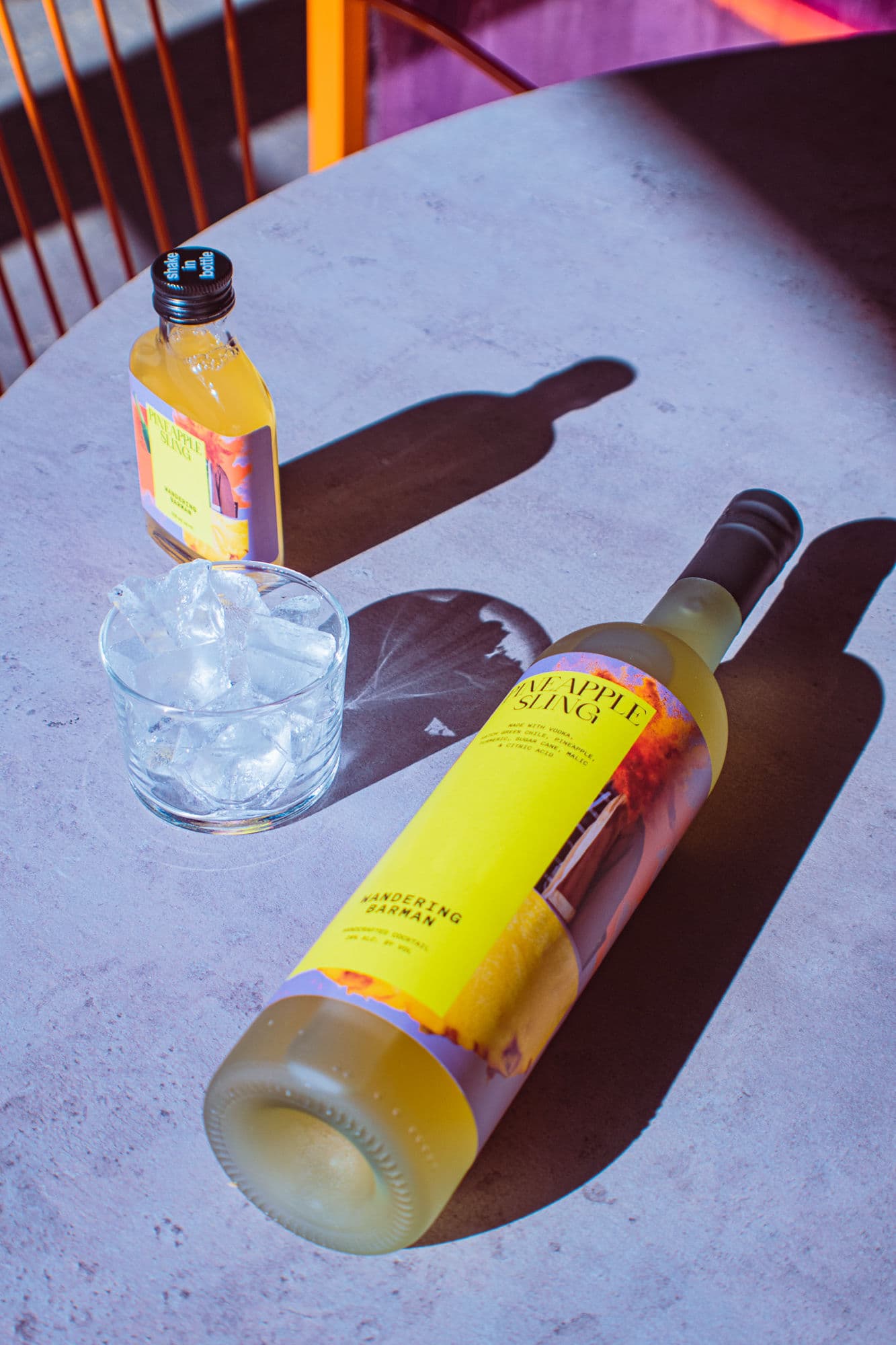 Pineapple Sling bottle and glass laid on the brasserie bar top